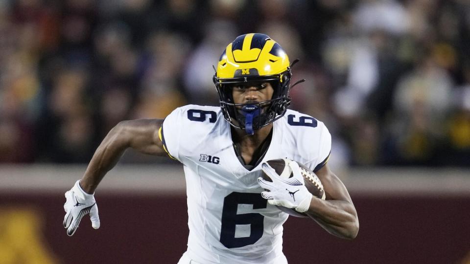 Michigan wide receiver Cornelius Johnson (6) runs against Minnesota.