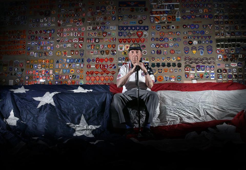 World War II, Korean War and Vietnam War veteran retired Army Lt. Col. Robert E. "Bob" Chisolm in 2018 sits with a military patch collection  at the Roy Benavidez-Robert Patterson All Airborne Chapter of the 82nd Airborne Division Association. It was donated by the family of charter member Maynard L. "Beamy" Beamesderfer.