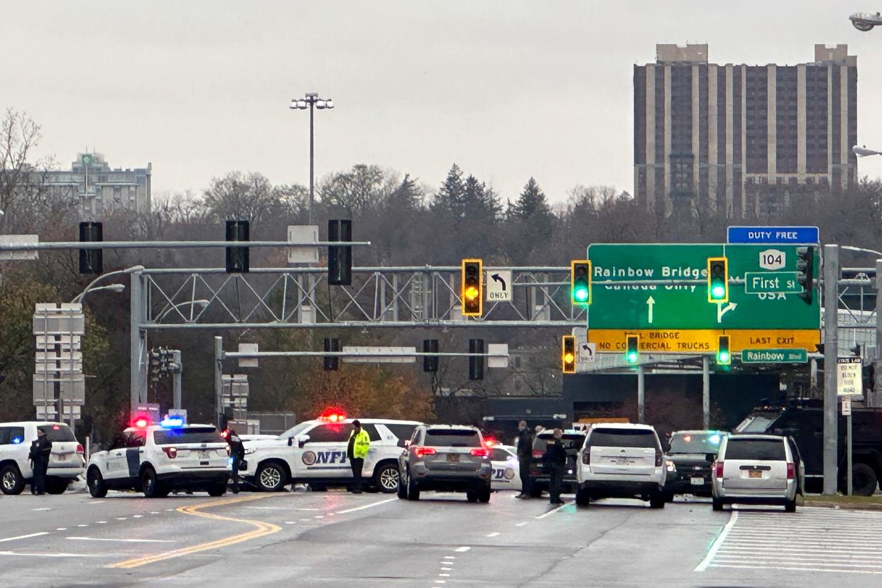 Law enforcement personnel block off the entrance to the Rainbow Bridge border crossing, Wednesday, Nov. 22, 2023, in Niagara Falls, N.Y.