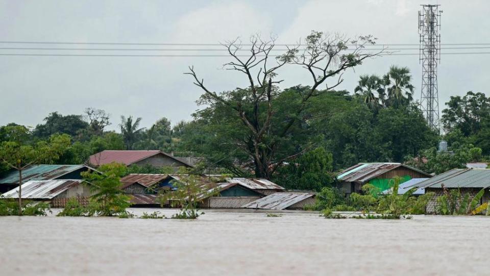 High flood water surrounds homes in Taungoo, Myanmar's Bago region on September 14, 2024