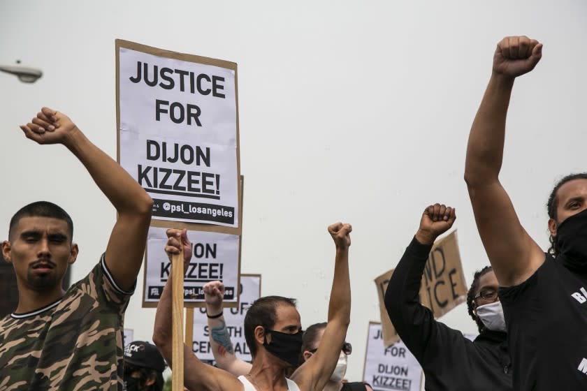 SOUTH LOS ANGELES, CA - SEPTEMBER 12: Protesters raise their fists as they march down Vermont Ave. during a protest calling for justice and in honor of Dijon Kizzee on Saturday, Sept. 12, 2020 in South Los Angeles, CA. Kizzee was killed by LA Sheriff's Deputies on Aug. 31 in the Westmont area and protests calling for the accountability of LASD have continued for the past week. (Josie Norris / Los Angeles Times)