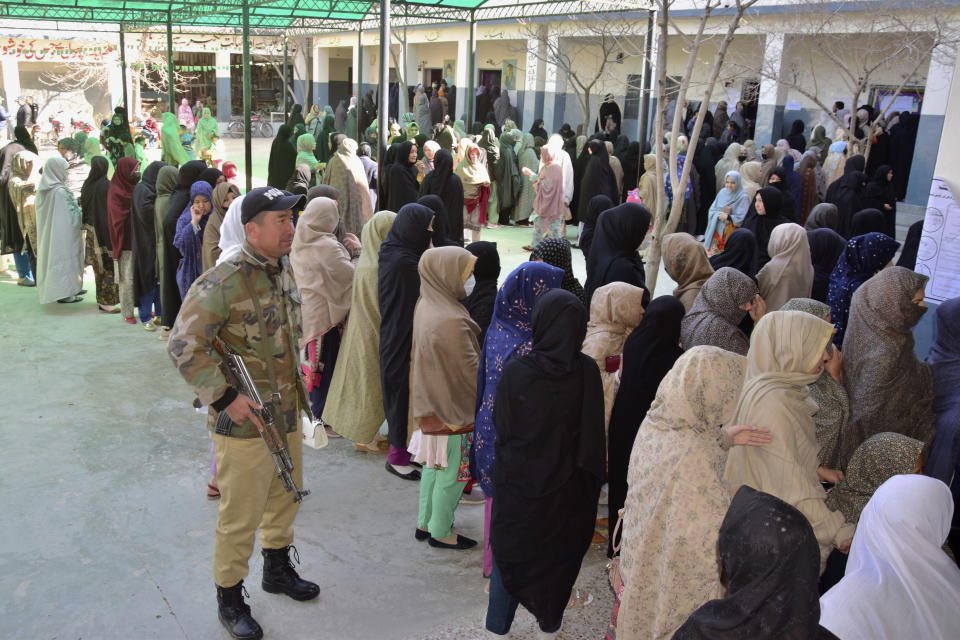 Women wait their turn to cast their vote at a polling station during the country's parliamentary elections in Quetta, Pakistan, Thursday, Feb. 8, 2024. Pakistanis lined braved cold winter weather and the threat of violence to vote for a new parliament Thursday, a day after twin bombings claimed at least 30 lives in the worst election-related violence ahead of the contested elections. (AP Photo/Arshad Butt)