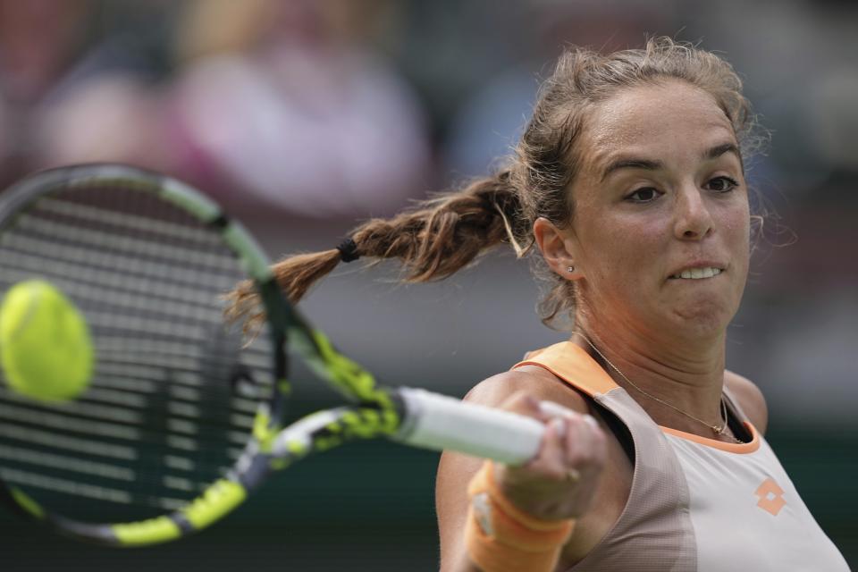 Lucia Bronzetti, of Italy, returns a shot to Coco Gauff, of the United States, at the BNP Paribas Open tennis tournament Monday, March 11, 2024, in Indian Wells, Calif. (AP Photo/Mark J. Terrill)