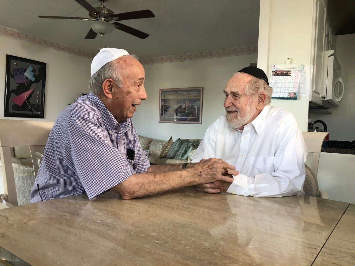 Holocaust survivors and boyhood friends Fred Behrend of Voorhees,  left, and Henry Baum of Southfield, Michigan, meet the first time in 80 years while wintering in Florida.