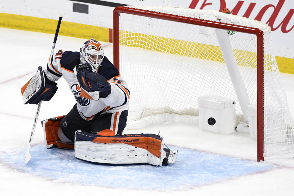 Edmonton Oilers goaltender Mike Smith (41) watches as a shot by Winnipeg Jets Nikolaj Ehlers gets past him in the first overtime period of an NHL hockey Stanley Cup playoff game, Sunday, May 23, 2021, in Winnipeg, Manitoba. (Fred Greenslade/The Canadian Press via AP)
