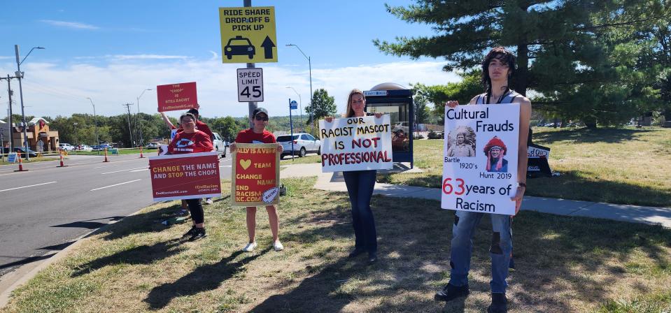 Members of the Not In Our Honor coalition protest outside the Arrowhead Stadium in Kansas City as Taylor Swift arrives to attend a Kansas City Chiefs game against the Chicago Bears.