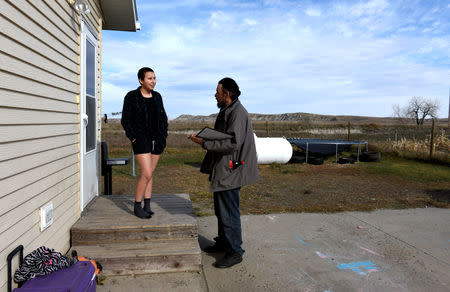 Ira Hanson speaks to a tribal member (L) while canvassing in Porcupine, North Dakota ahead of the 2018 mid-term elections on the Standing Rock Reservation, U.S. October 26, 2018. REUTERS/Dan Koeck