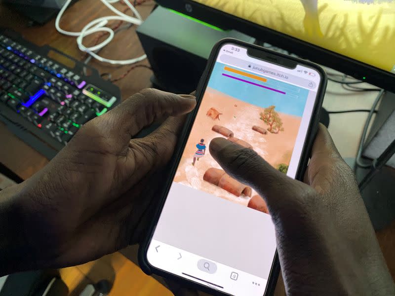 Video game developer Lual Mayen, 25, who learned to code in a refugee camp after fleeing South Sudan, plays his new game at his home in Washington, D.C.