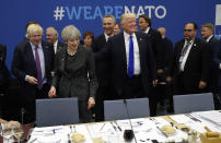 <p>U.S. President Donald Trump touches the back of British Prime Minister Theresa May during a working dinner meeting at the NATO headquarters during a NATO summit of heads of state and government in Brussels on May 25, 2017. US President Donald Trump inaugurated the new headquarters during a ceremony with other heads of state and government. (Photo: Matt Dunham/AP) </p>