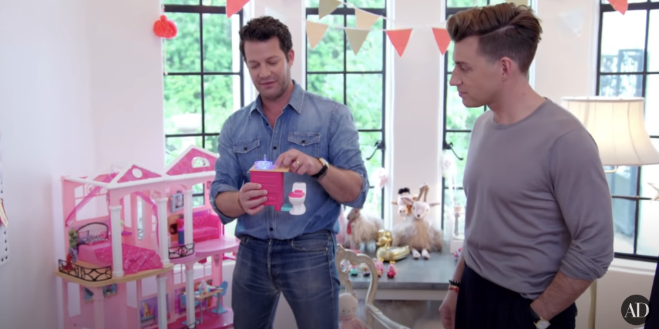 Nate Berkus and Jeremiah Brent with their daughter's dollhouse bathroom