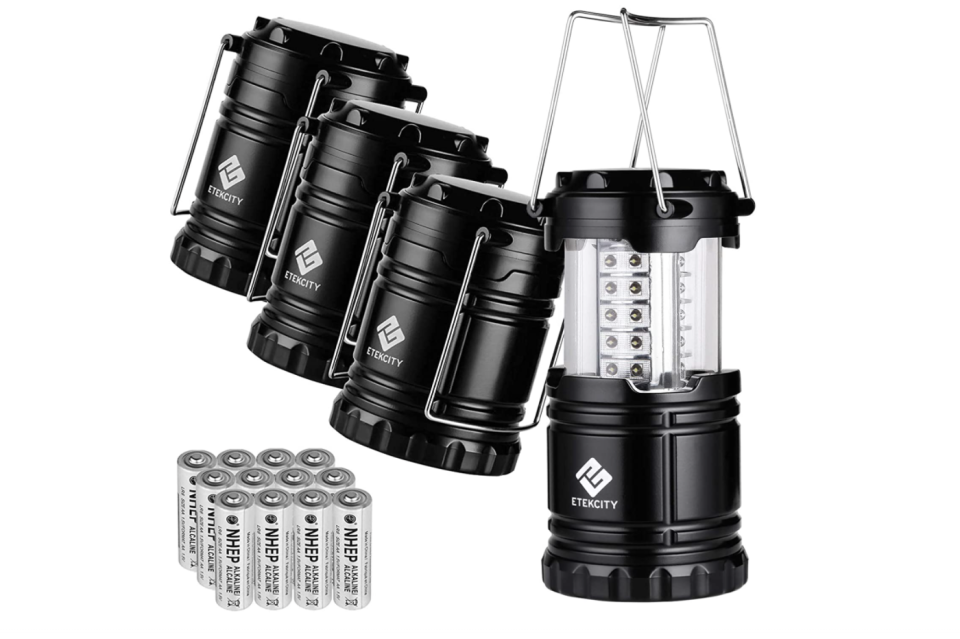 Four black lanterns with battery pack. 