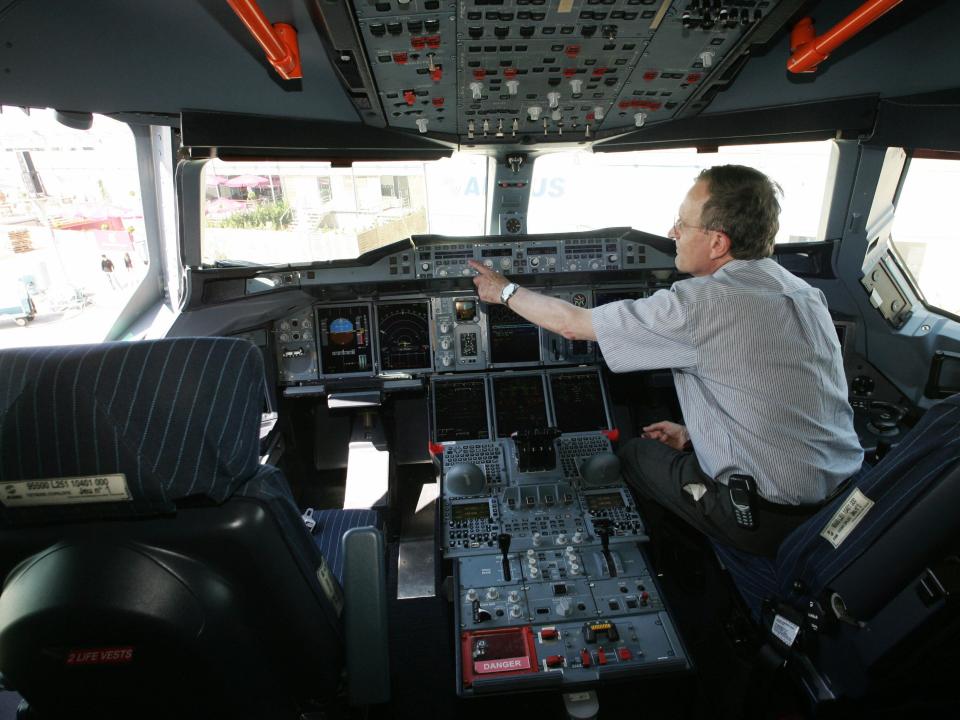 Airbus A380 pilot Jacques Rosay sitting in the plane's cockpit at Le Bourget airport on June 12, 2005 a few minutes after the plane landed near Paris.