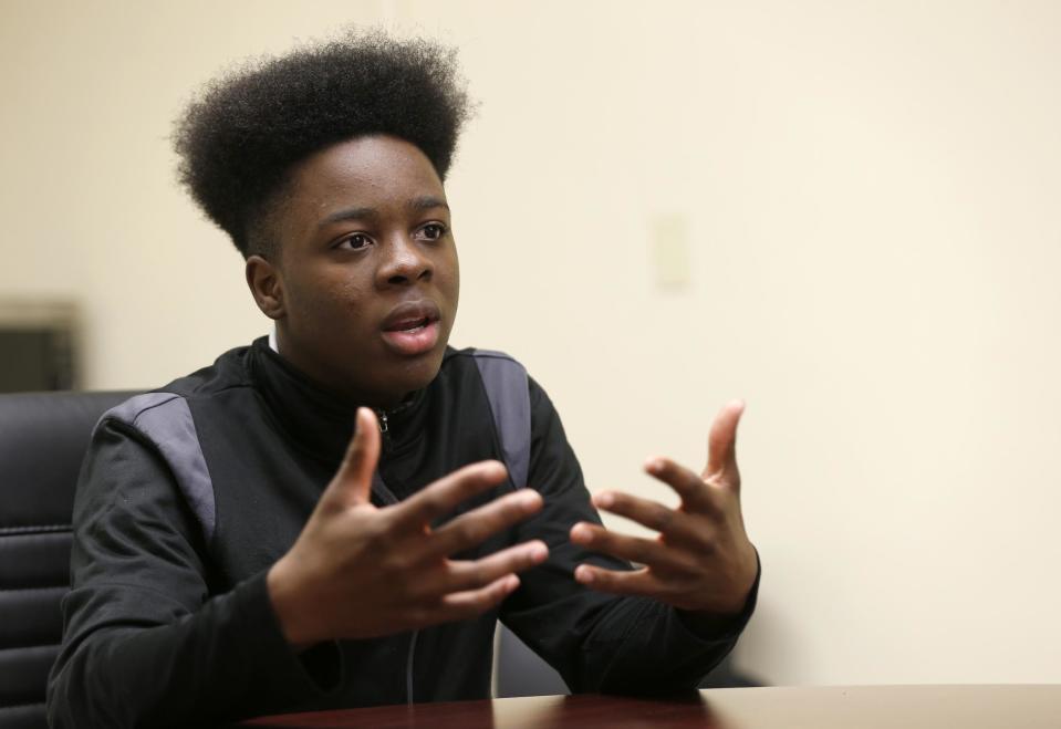 Kamal Ani-Bello, a student at Miami Northwestern Senior High School who acted in the movie "Moonlight," speaks during an interview with The Associated Press, Monday, Feb. 27, 2017, in Miami. “The best thing about this movie is they actually went into the projects and shot it, and they let kids from around Liberty City be in it,” said Ani-Bello. (AP Photo/Wilfredo Lee)