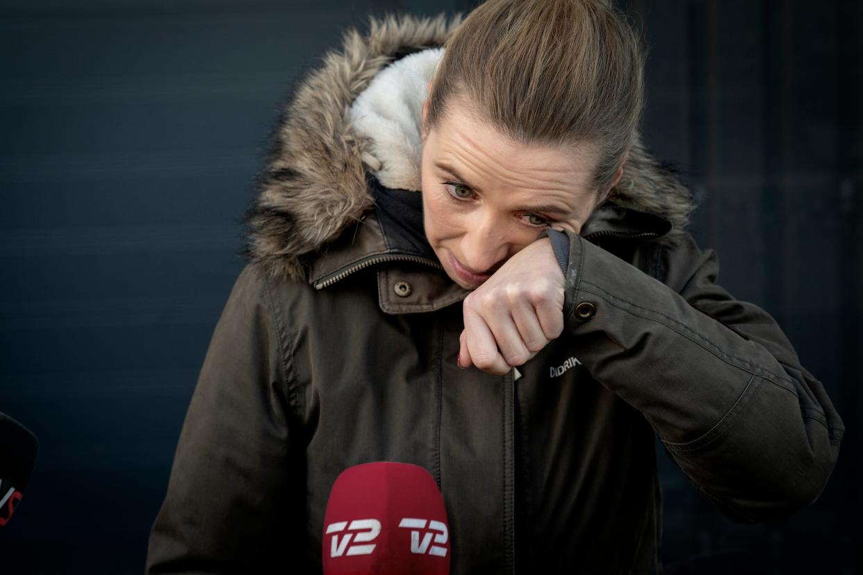 <p>Denmark's Prime Minister Mette Frederiksen reacts after a visit to an empty mink farm</p> (EPA)