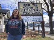 Telisa Swan stands in front of a message she put on her business' marquee in Moscow, Idaho on Friday, Jan. 6, 2023. Swan says she was elated when a suspect was arrested in the case of four University of Idaho students stabbed to death in November (AP Photo/Manuel Valdez)