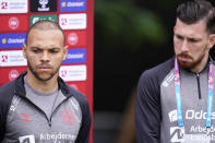 Danish players Martin Braithwaite, left, and Pierre-Emile Hojbjerg attend a press conference, in Elsinore, Denmark, Monday, June 14, 2021. Denmark played their opening Euro 2020 group game against Finland on Saturday when during the first half Denmark's player Christian Eriksen's heart stopped and and was given lengthy medical treatment before regaining consciousness. (Liselotte Sabroe/Ritzau Scanpix via AP)