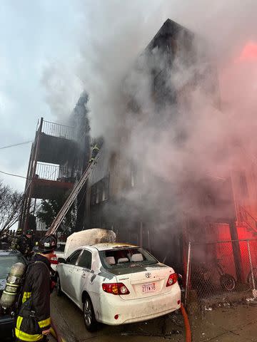 <p>Boston Fire Dept./X</p> A fire tears through a Boston building on April 2, 2024