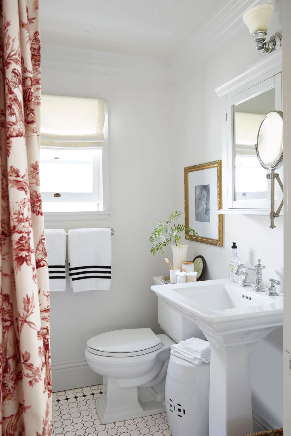 <p>Janet and Larry Korff took out the bulky bathroom door and replaced it with a stylish curtain. The upgrade makes the space feel far less cramped, but it still ensures privacy.</p>