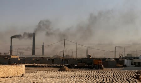 A general view of brick factories as smoke rises from the stacks in the town of Nahrawan in Baghdad