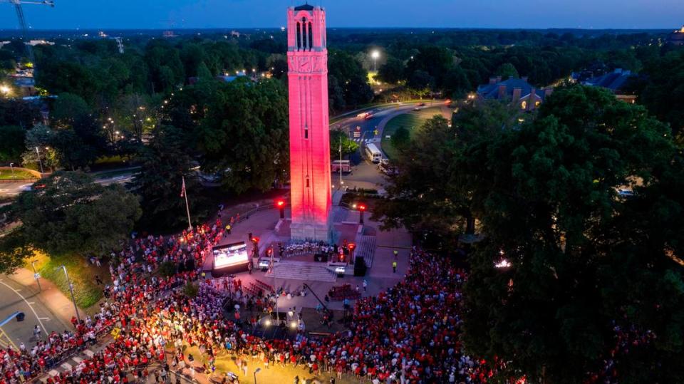 NC State’s Memorial Belltower is bathed in red light as more than a thousand fans celebrate the men’s and women’s basketball teams’ Final Four runs on Monday, April 15, 2024. Travis Long/tlong@newsobserver.com