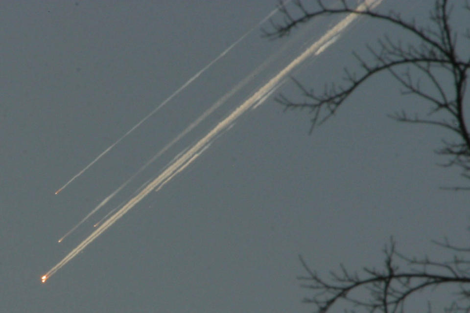 FILE - Debris from the space shuttle Columbia streaks across the Texas sky as seen from Dallas on Saturday, Feb. 1, 2003. NASA marked the 20th anniversary of the tragedy with somber ceremonies and remembrances during its annual tribute to fallen astronauts on Thursday, Jan. 26, 2023. (AP Photo/Jason Hutchinson/file)