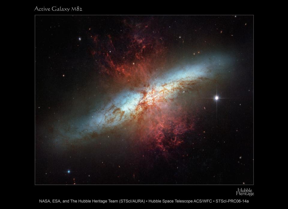 Plumes of glowing hydrogen blast from the central nucleus of M82. The pale, star-like objects are clusters of tens to hundreds of thousands of stars.  Credit: NASA, ESA, and The Hubble Heritage Team (STScI/AURA)  Acknowledgment: J. Gallagher (University of Wisconsin), M. Mountain (STScI), and P. Puxley (National Science Foundation)