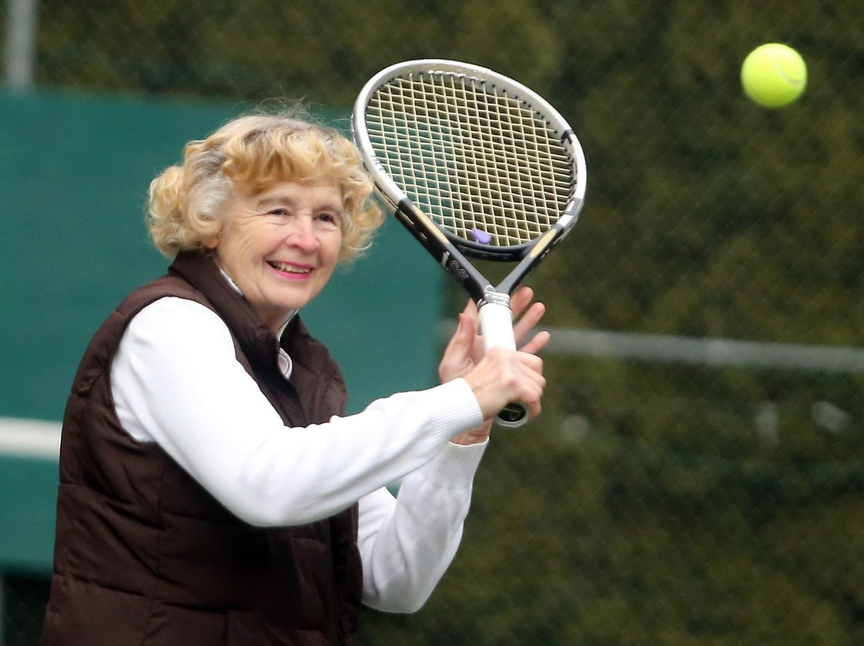 June Wurden smiles as she returns a shot while playing tennis at her home in Brownsville in 2015. Wurden died in August at age 88 after having a stroke while playing tennis, leaving behind many memories of her community involvement.