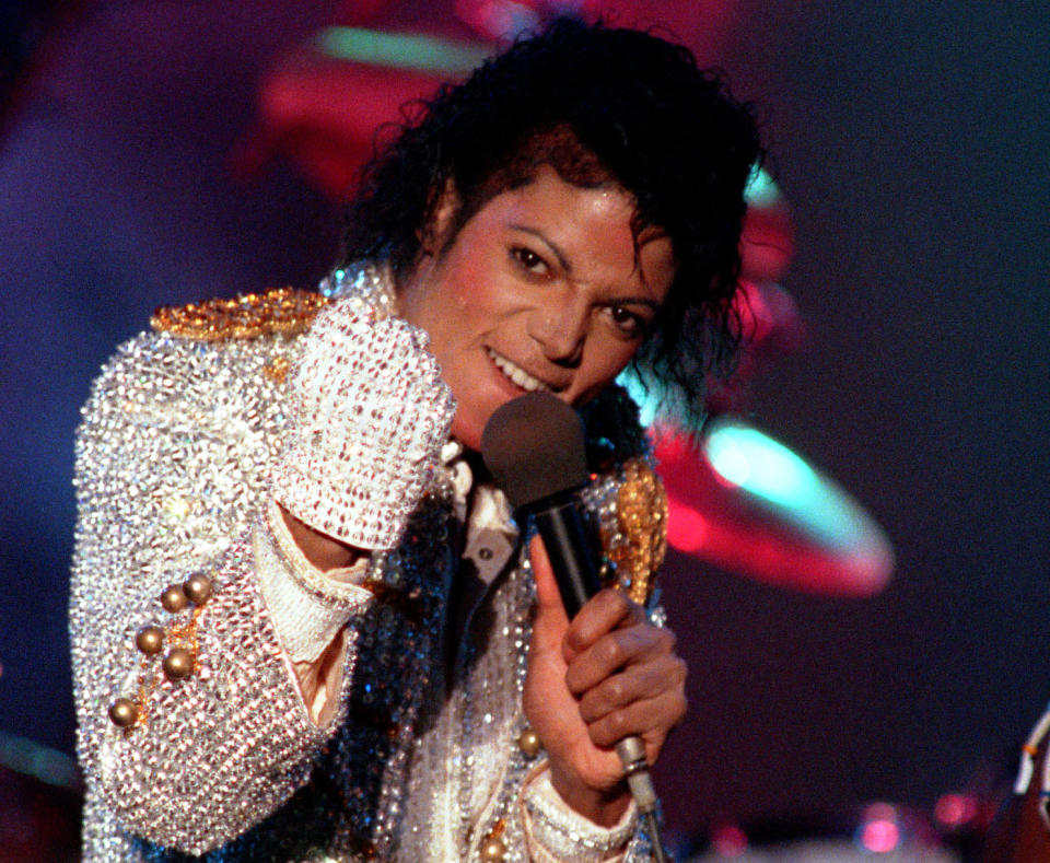 FILE - In this Dec. 3, 1984 photo, Michael Jackson performs with his brothers at Dodger Stadium in Los Angeles, as part of their Victory Tour concert. Jackson's earning potential may become an issue when a Los Angeles jury begins deliberating a negligent hiring lawsuit filed by the singer's mother, Katherine Jackson, against concert giant AEG Live LLC over her son's 2009 death. Witnesses have testified throughout the 21-week trial that the pop superstar was planning a new career in movies after completing his "This Is It" tour that was scheduled to begin in July 2009. (AP Photo/Doug Pizac, file)