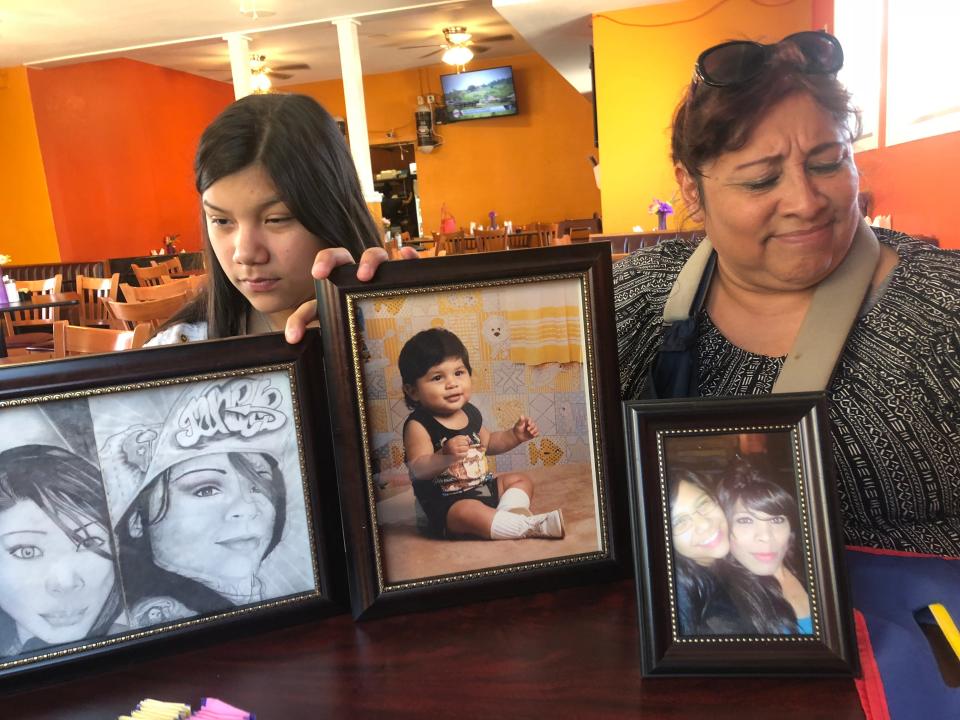 Rosenda Ortiz, left, and Patricia Ortiz, sister and aunt of Nikki Enriquez, display pictures and drawings of Enriquez. She was one of at least 29 transgender people killed in 2018.