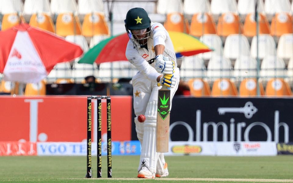 The ball goes past the edge of Naseem Shah's bat