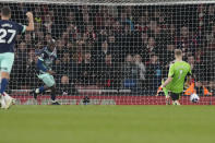 Brentford's Yoane Wissa, second from left, scores his side's first goal past Arsenal's goalkeeper Aaron Ramsdale during the English Premier League soccer match between Arsenal and Brentford at the Emirates Stadium in London, England, Saturday, March 9, 2024. (AP Photo/Frank Augstein)