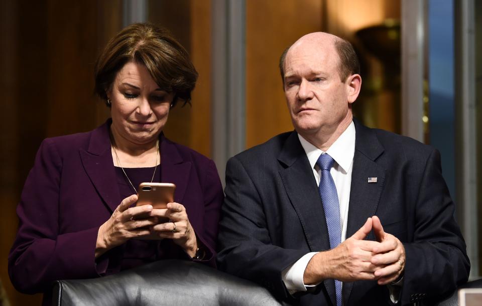 Senate Judiciary Committee members Amy Klobuchar (D-MN) (L) and Christopher Coons (D-DE) look on after a markup hearing on Capitol Hill in Washington, DC on September 28, 2018, on the nomination of Brett M. Kavanaugh to be an associate justice of the Supreme Court of the United States. - Kavanaugh's contentious Supreme Court nomination will be put to an initial vote Friday, the day after a dramatic Senate hearing saw the judge furiously fight back against sexual assault allegations recounted in harrowing detail by his accuser. (Photo by Brendan SMIALOWSKI / AFP)        (Photo credit should read BRENDAN SMIALOWSKI/AFP/Getty Images)