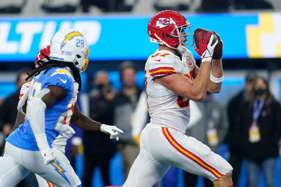 Travis Kelce scores the winning touchdown in overtime against the Chargers.