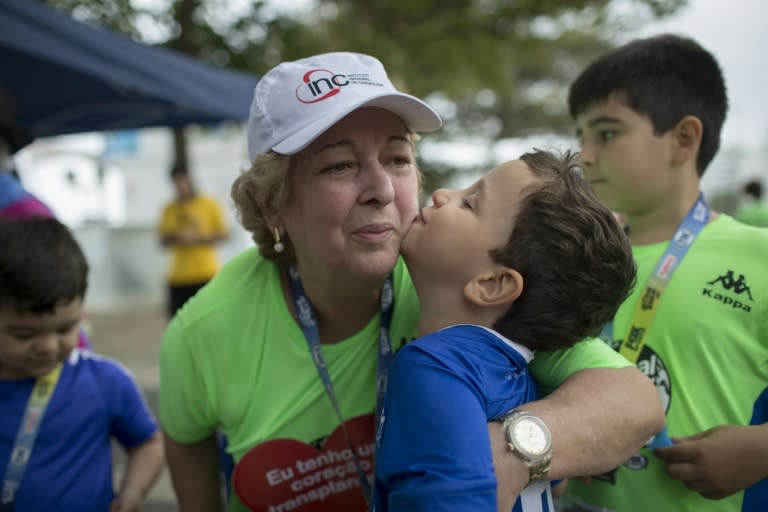 Ivonette Balthazar hugs one of her grandchildren after participating in the race