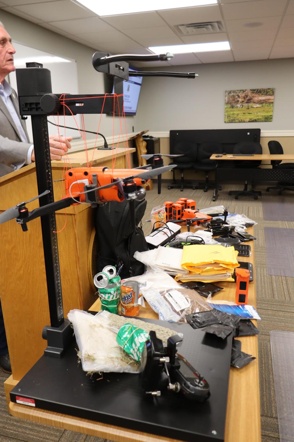 The drugs and other items seized over this past weekend during a traffic stop is displayed at a Grant Parish Sheriff's office Thursday morning. The drugs were valued at more than $1.2 million, and the two drones are worth about $4,700 each. Also seized were eight cellphones. The drugs were destined for the U.S. Penitentiary in Pollock, as well as other federal institutions across the country.