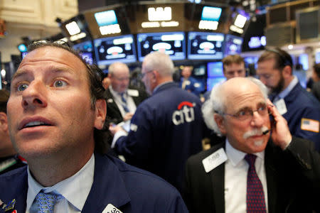 Traders work on the floor of the New York Stock Exchange (NYSE) in New York City, U.S., August 23, 2016. REUTERS/Brendan McDermid