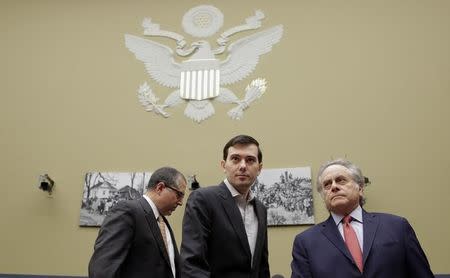 Martin Shkreli, (C) former CEO of Turing Pharmaceuticals LLC, arrives with his attorneys before a House Oversight and Government Reform hearing on "Developments in the Prescription Drug Market Oversight" on Capitol Hill in Washington February 4, 2016. REUTERS/Joshua Roberts