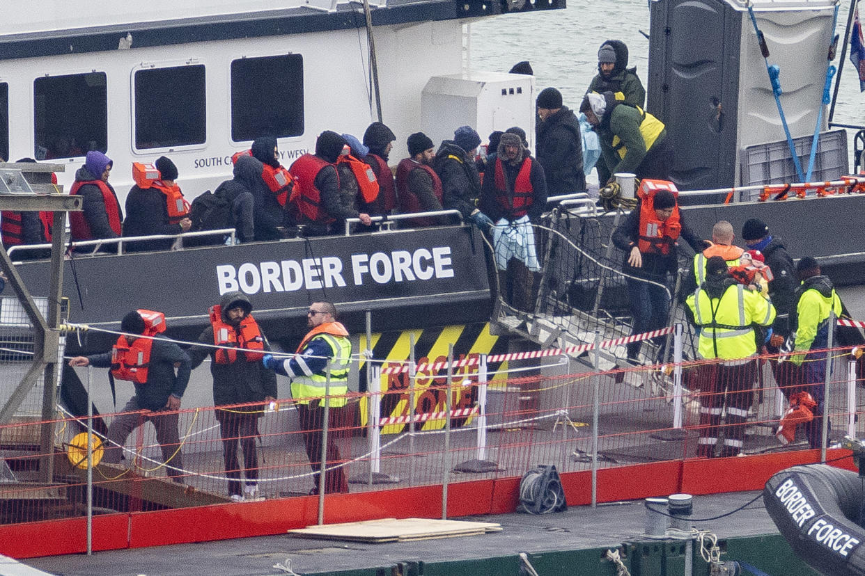 DOVER, ENGLAND - MARCH 06: Migrants including women and children are removed from a Border Force vessel after being picked up in the Channel on March 06, 2023 in Dover, England. On Tuesday, the British government is expected to announce a range of new measures to deter migrants from crossing the English Channel by boat. The new legislation would require their immediate removal to Rwanda or a 