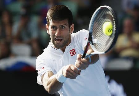 Tennis - Australian Open - Melbourne Park, Melbourne, Australia - 19/1/17 Serbia's Novak Djokovic hits a shot during his Men's singles second round match against Uzbekistan's Denis Istomin. REUTERS/Issei Kato