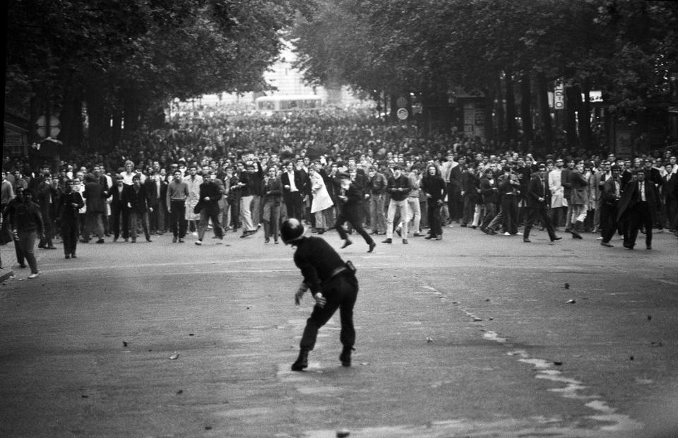 <p>A police officer confronts defiant students on the Boulevard Saint-Michel during the first day of violent clashes in Paris on May 6, 1968. In all, 1,045 civilians were wounded during what became known as “the night of the barricades.” (Photo: Gökşin Sipahioğlu/SIPA) </p>