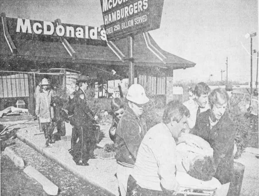 A McDonald's assistant manager is carried away after a blast ripped through the Newark McDonald's on Dec. 1, 1976.