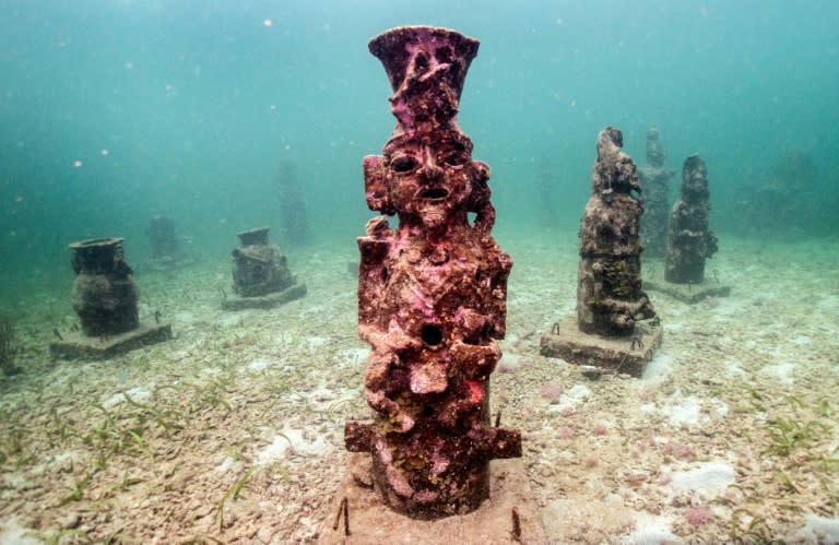 Twenty-five sculptures scatter the Caribbean seafloor off Colombia's coast, where they host coral growth (Luis ACOSTA)