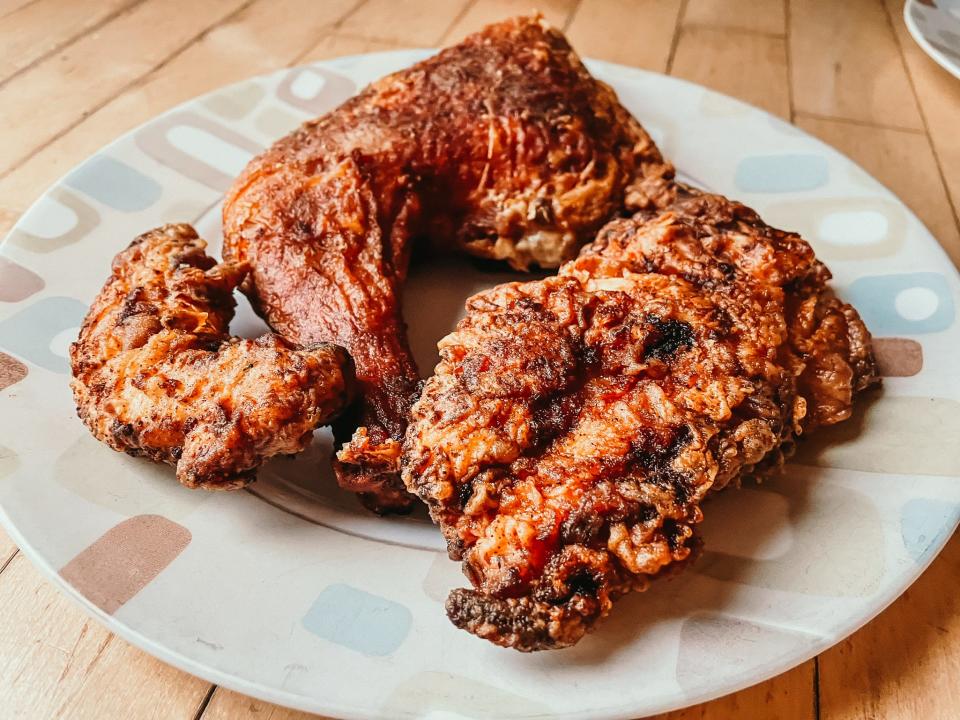 three pieces of crispy fried chicken on a plate
