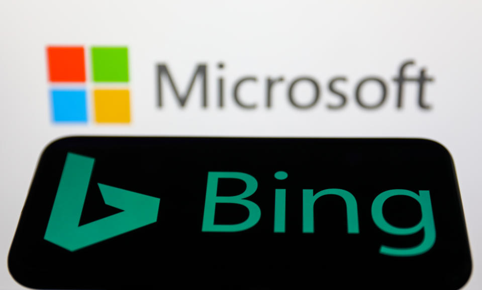 Bing logo displayed on a phone screen and Microsoft logo displayed on a screen in the background are seen in this illustration photo taken in Krakow, Poland on May 26, 2022. (Photo Illustration by Jakub Porzycki/NurPhoto via Getty Images)