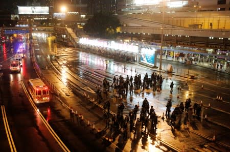 Police and riot police is seen at the entrance of Cross-Harbour Tunnel after protesters block the tunnel in Hong Kong,