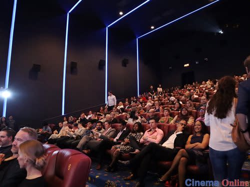 The audience eagerly waiting for the opening film, "Beside Me", to screen.