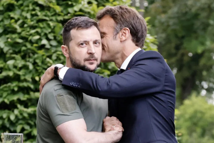 Ukrainian President Volodymyr Zelenskyy, left, shakes hands with France's President Emmanuel Macron after a press conference in Kyiv, Thursday, June 16, 2022.