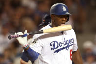 <p>Yasiel Puig #66 of the Los Angeles Dodgers licks his bat during the fifth inning against the Houston Astros in game two of the 2017 World Series at Dodger Stadium on October 25, 2017 in Los Angeles, California. (Photo by Christian Petersen/Getty Images) </p>