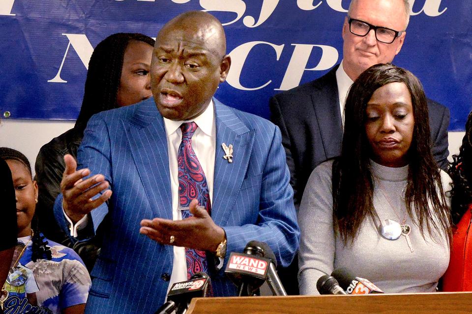 Civil rights attorney Ben Crump, left, retained by the family of Earl Moore Jr., speaks during a news conference at the Springfield, Ill., NAACP with Moore's mother Rosena Washington, right, Thursday Jan. 19, 2023, In Springfield. Moore's family has filed a lawsuit against the two paramedics and their employer, in the death of Moore attorneys said Thursday. (Thomas Turney/The State Journal-Register via AP)