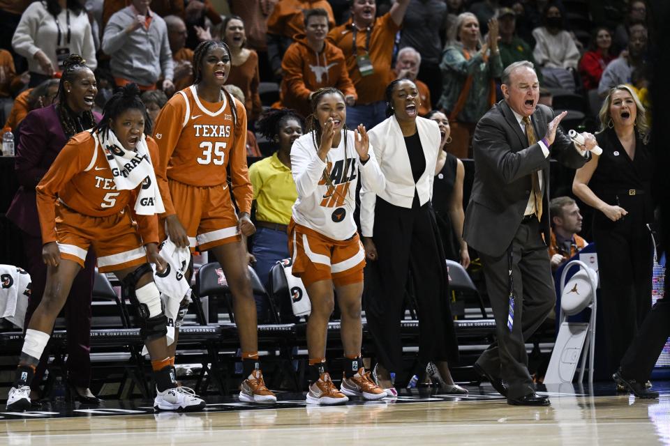 Texas head coach Vic Schaefer, right, likes what he sees during Texas' win over Baylor in the Big 12 Tournament championship game. Schaefer led the Longhorns to the Elite Eight for the second straight year.